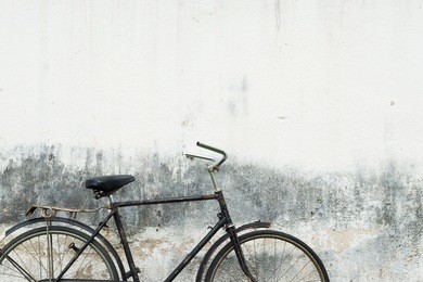 retro bicycle with concrete wall background.
