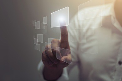 businessman pushing on a touch screen interface / soft focus picture / vintage concept