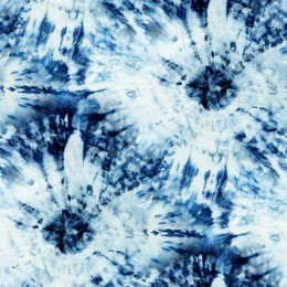 seamless tie-dye pattern of indigo color on white silk. hand painting fabrics - nodular batik. shibori dyeing. 