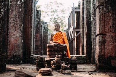ancient buddha statue in bayon temple, angkor, siem reap, cambodia.