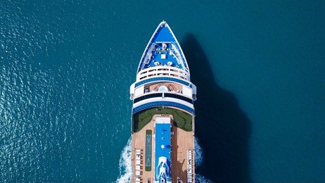 large cruise ship sailing across the mediterranean sea - aerial image