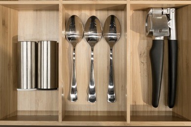 kitchenware spoon salt bottle and pepper bottle in wood tray 