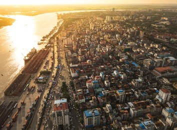 aerial  shot,view from the drone on the road junction and city of yangon near rangoon river at sunset colors ,myanmar