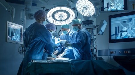 medical team performing surgical operation in modern operating room