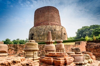 dhamek stupa is a massive stupa located at sarnath, 13 km away from varanasi in the state of uttar pradesh, india. stupas originated as pre-buddhist tumuli