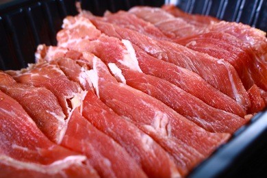 fresh uncooked raw sukiyaki thin sliced meat