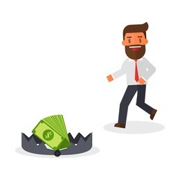 greedy businessman running to money on bear trap