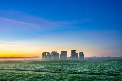 stonehenge at foggy winter sunrise | england