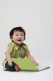 a cute toddler with a book