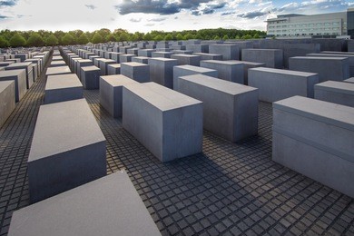 view of famous memorial of the jewish holocaust with the beautiful sky on the background, berlin, germany