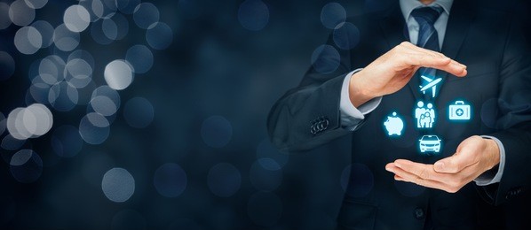 insurance concept. businessman with protective gesture and insurance icons: car, travel, family and life, financial and health insurance.