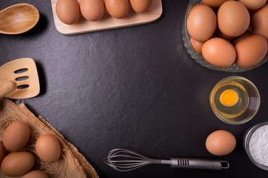 fresh farm eggs whipping eggs and kitchenware,top view, with copy space