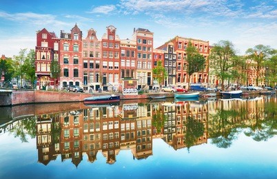 traditional dutch old houses on canals in amsterdam, netherland.