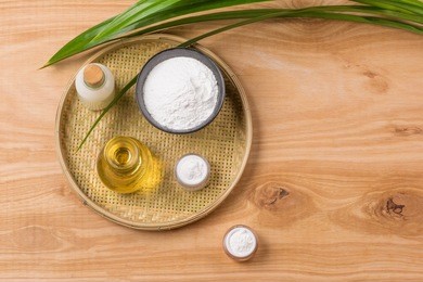 rice flour in a wooden bowl, milk and oil with rice on the old
