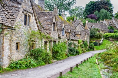 houses of arlington row in the village of bibury, england, united kingdom