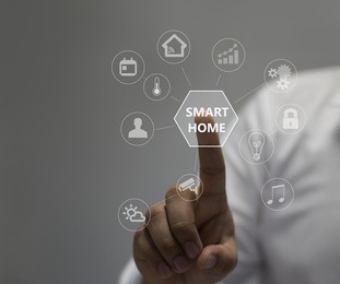 circular futuristic interface of smart home automation assistant on a virtual screen and a user touching a button