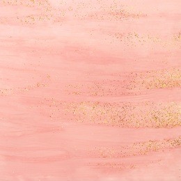 pink watercolor background with golden glitter. abstract hand painted backdrop.