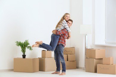 young couple in room at new home