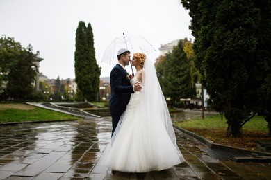 wedding kiss in the rain