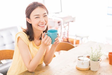 young attractive asian woman who drink coffee