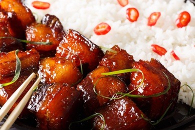 vietnamese food: caramelized pork belly with rice macro. horizontal background