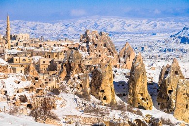 pigeon valley and cave town in goreme during winter time. cappadocia, turkey. open air museum, goreme national park. heavenly landscape