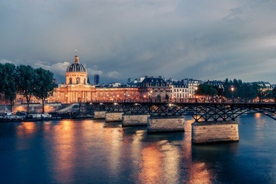 famous pont des arts in paris, france at night. spectacular cityscape.