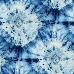 seamless tie-dye pattern of indigo color on white silk. hand painting fabrics - nodular batik. shibori dyeing. 