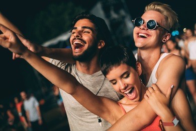 group of friends having great time on music festival