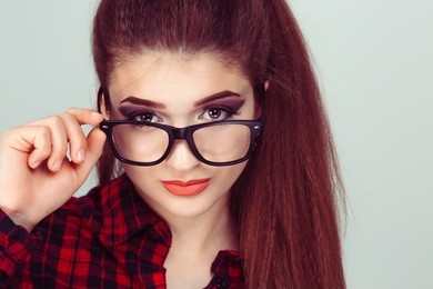 at you with disapproval pulling down her eye glasses skeptically