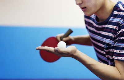 asian guy playing table tennis