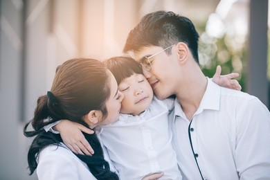 asian family happy with child over house background