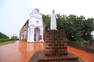 st. paul's church with a statue of st. francis xavier in malacca, malaysia