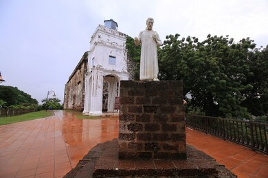 st. paul's church with a statue of st. francis xavier in malacca, malaysia