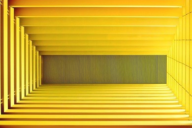 perspective view of abstract modern ceiling with strong geometry and symmetry as background with sapce for copy
