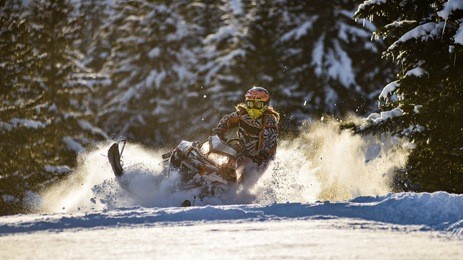 rider on the snowmobile in the mountains ski resort in sakhalin island russia.
