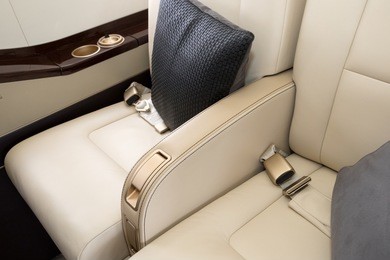 comfortible chairs in a modern business jet airplane.