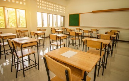 school empty classroom with test sheet or exams paper on desks chair wood and greenboard at high school thailand, education test concept