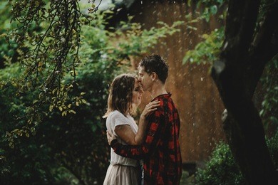 the lovely couple in love embracing in the park