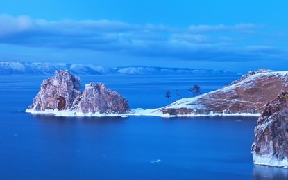 lake baikal. december evening on the olkhon island. a view on the shamanka rock natural landmark 