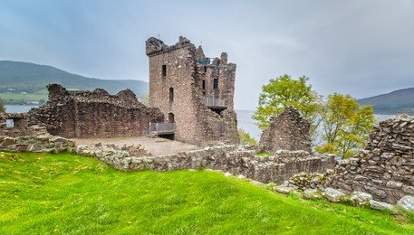 urquhart castle with dark cloud sky