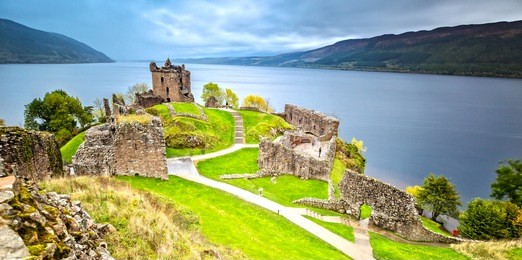 urquhart castle with dark cloud sky