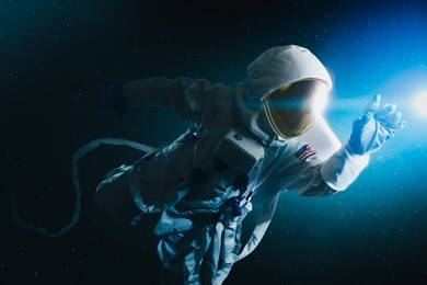 astronaut floating in outer space / high contrast image
