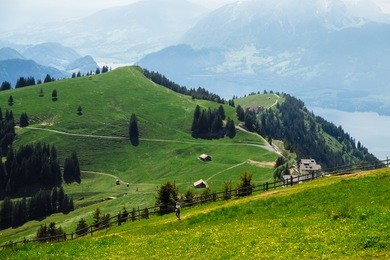 the tourism is waling on rigi mountain ; also known as queen of the mountains) is a mountain massif of the alps, located in central switzerland.
