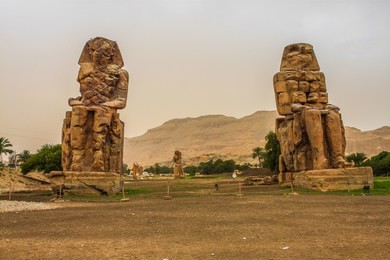 the colossi of memnon - two massive stone statues of pharaoh amenhotep iii. egypt. luxor. 