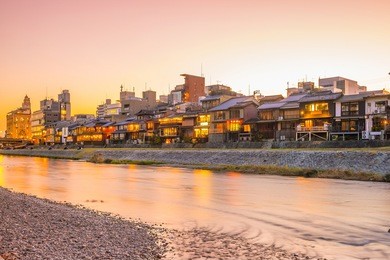 old house, restaurant and kamo river at twilight, gion, kyoto, japan