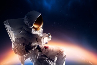 astronaut floating in outer space / high contrast image