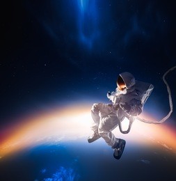 astronaut floating in outer space / high contrast image