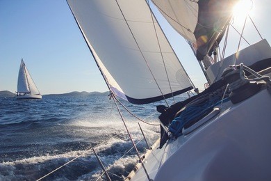 sailing in the wind through the waves, yachts at sailing regatta