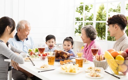 happy asian family having dinnerÂ at home